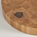Detail of the engraving in a circular chopping board