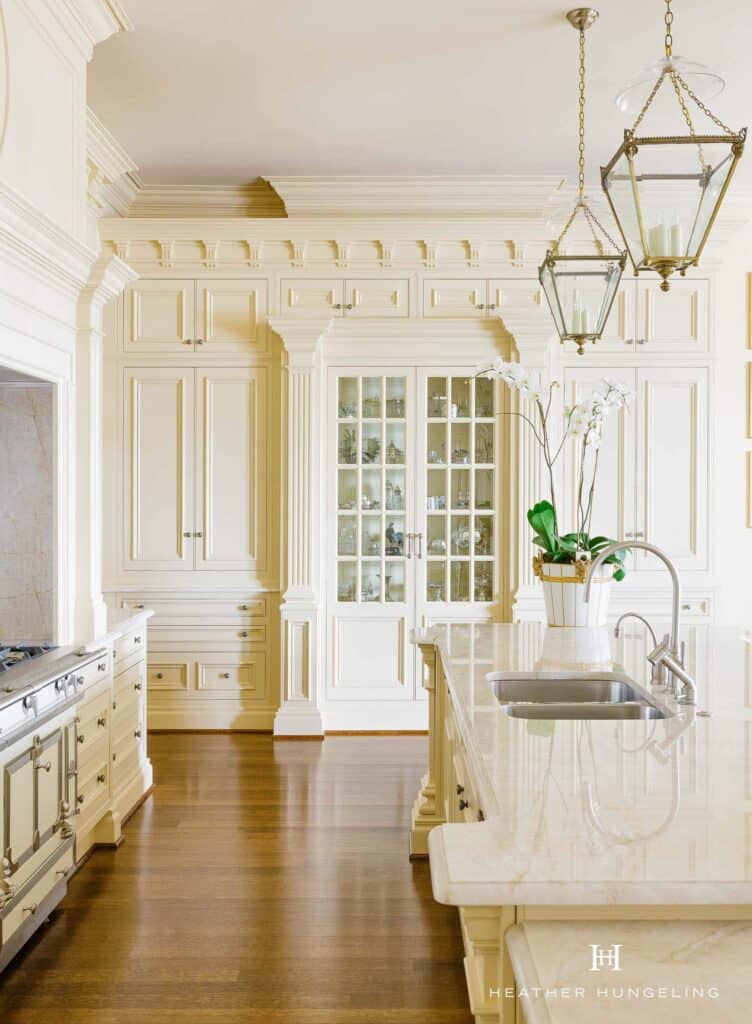 A Clive Christian Furniture Architectural kitchen, finished in classic cream. Featuring glass-fronted cupboards.