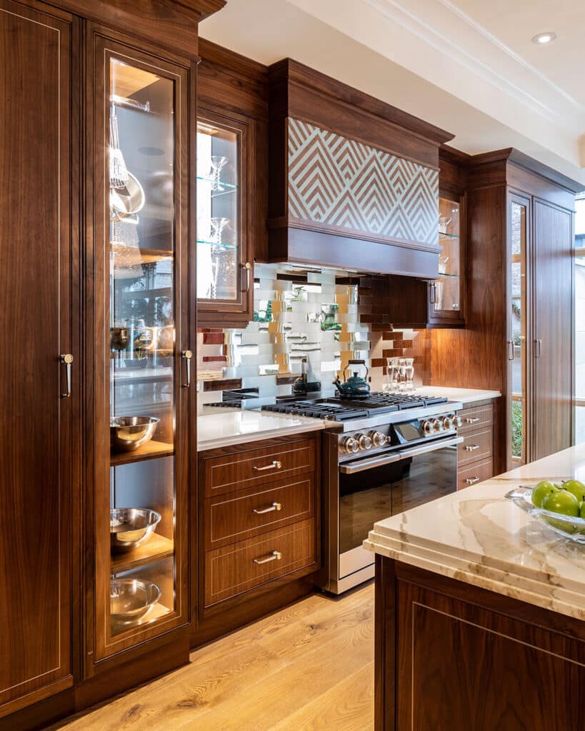 Metro Deco Kitchen in Cool Walnut with drawer fronts detailed by Brass metal inlay.